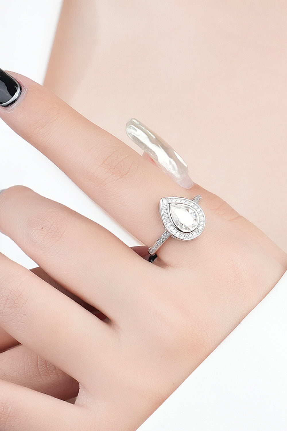 Bezeled Teardrop Moissanite Ring